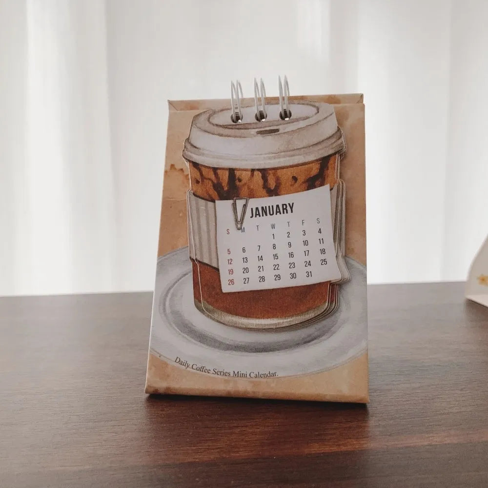 A5 size 2025 mini desk calendar open to a page showing a date and motivational quote.
