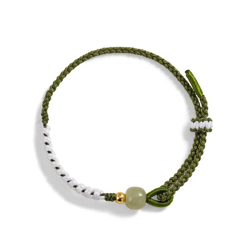 Colourful national fashion bracelet with Hetian jade and sterling silver carrying strap on a neutral background