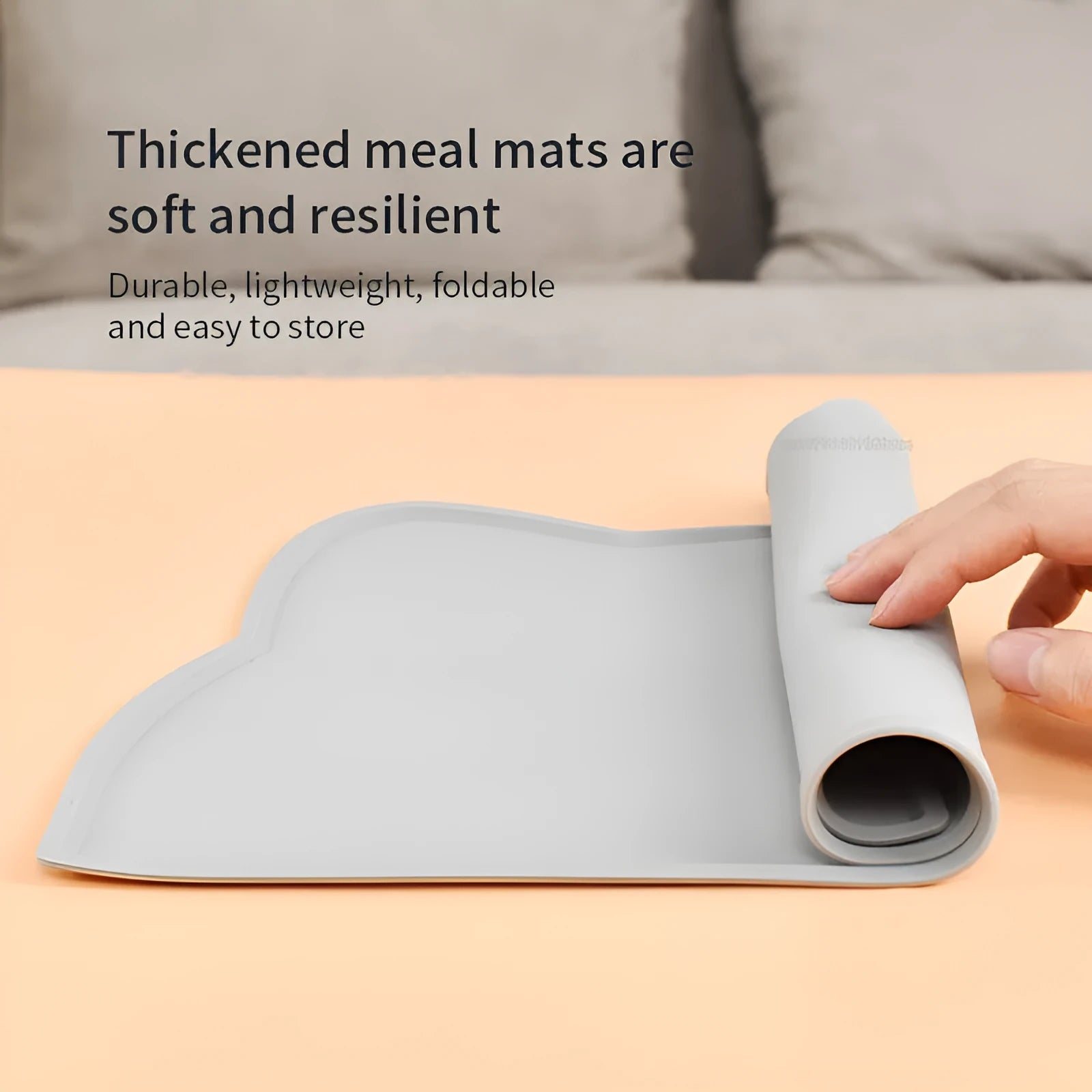 Waterproof silicone pet feeding mat in grey, cat head shape, 44x24cm, with a pet bowl on top