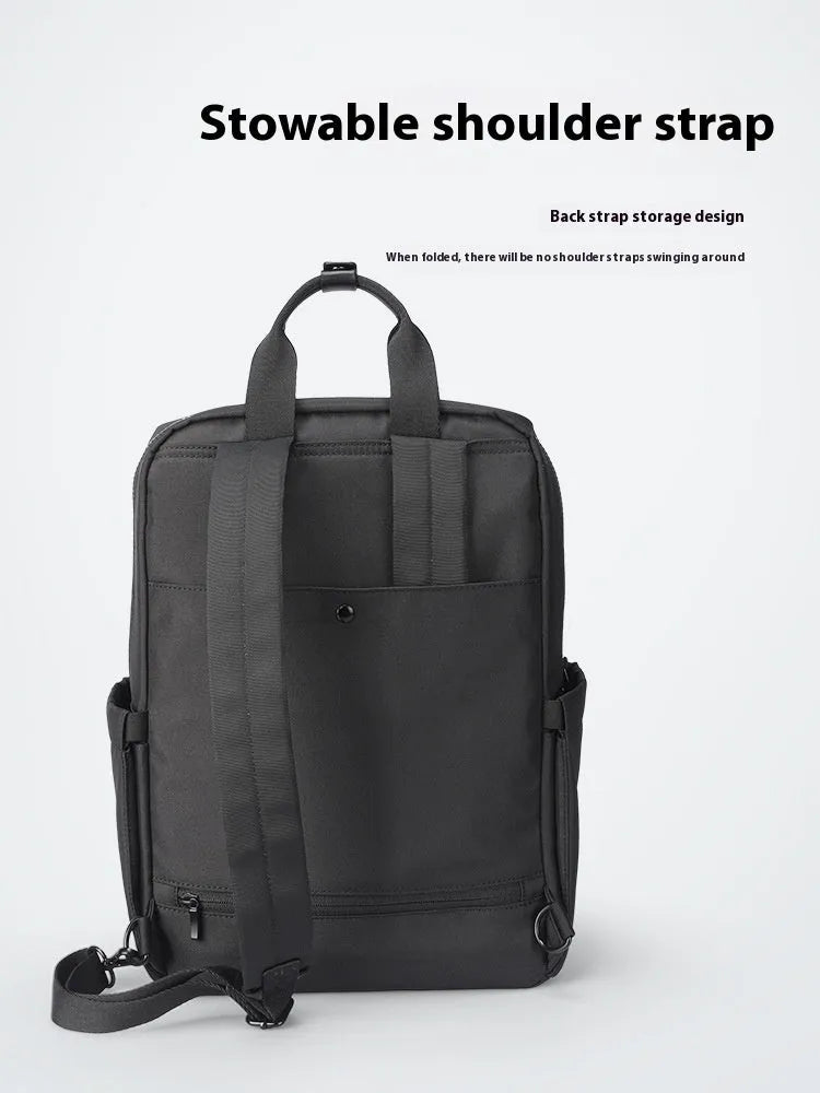 Black Oxford cloth computer backpack showing laptop compartment and storage organisation