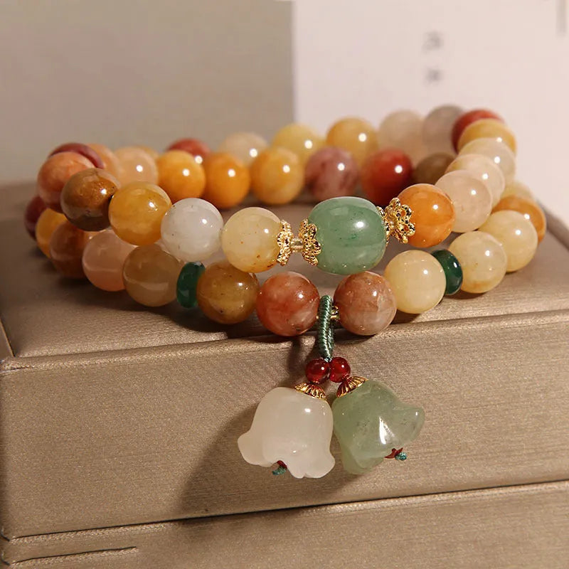 Natural Jinsi Jade multi-layer bracelet for women with orchid pendant colour option on plain background