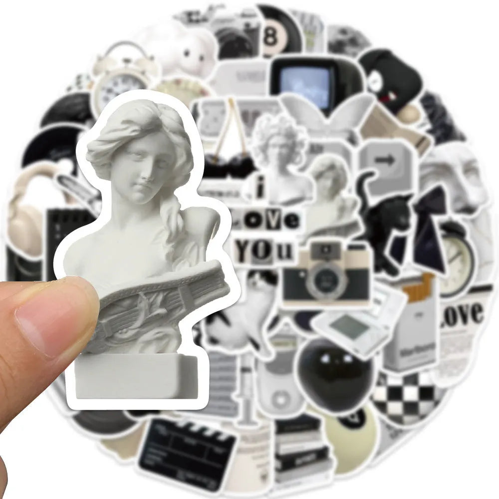61 black and white waterproof PVC stickers for laptops and phones on a sheet.