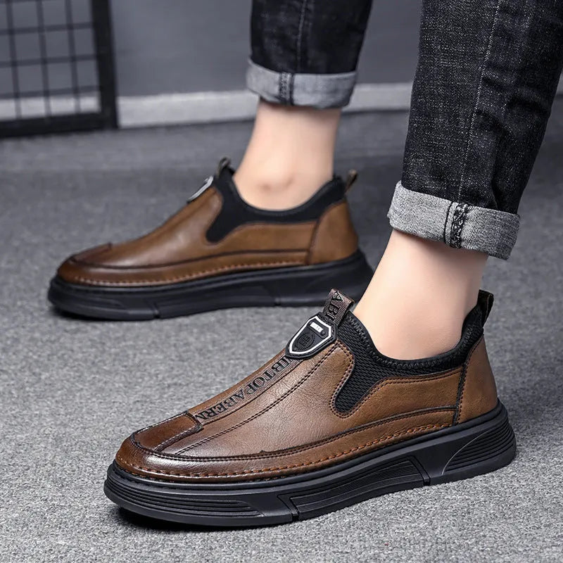 Men's solid colour casual leather shoes with round toe design in black and brown options