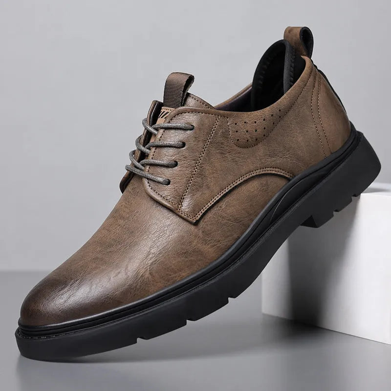 Men's black and brown leather casual sneakers with rubber sole and sewing line detailing