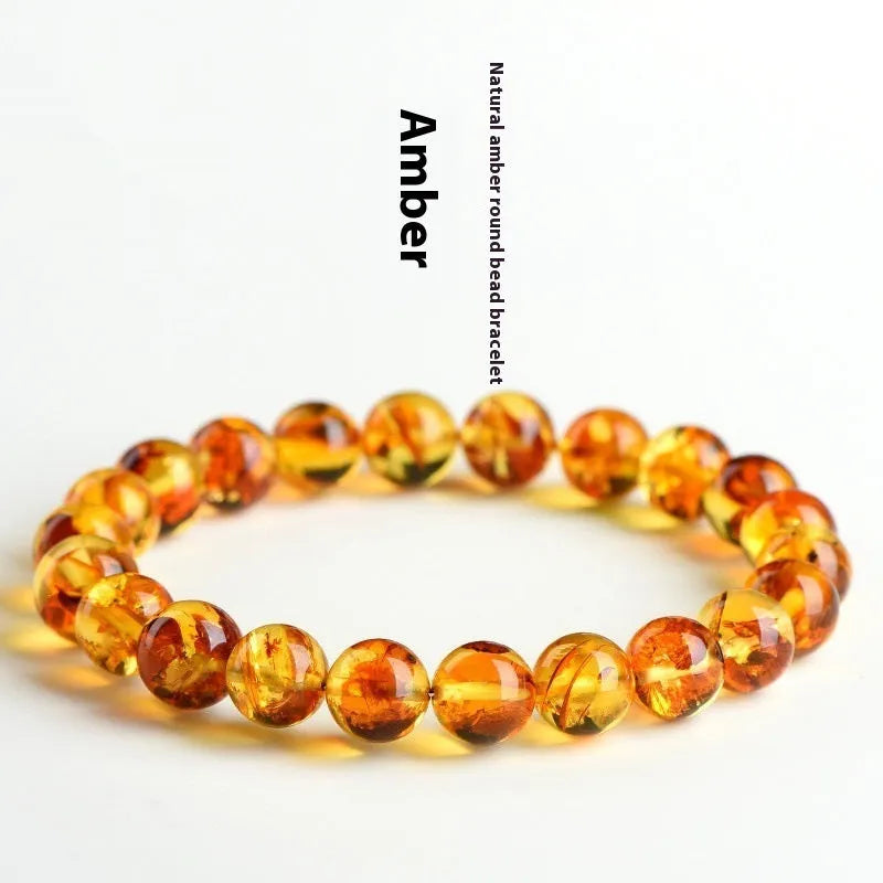 Natural yellow piebald amber bracelet with geometric beads showing distinctive flower spot patterning