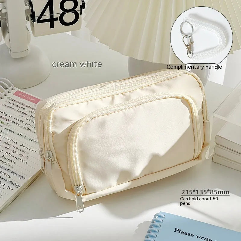 Double-layer pencil case in blue with gift handle, showing high-capacity storage for exam stationery