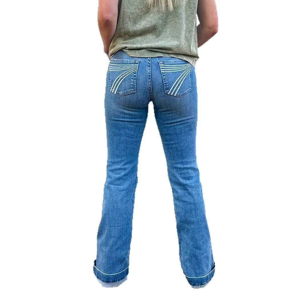 Women's slim fit jeans with elastic mid-waist, flared leg, and embroidered detail.