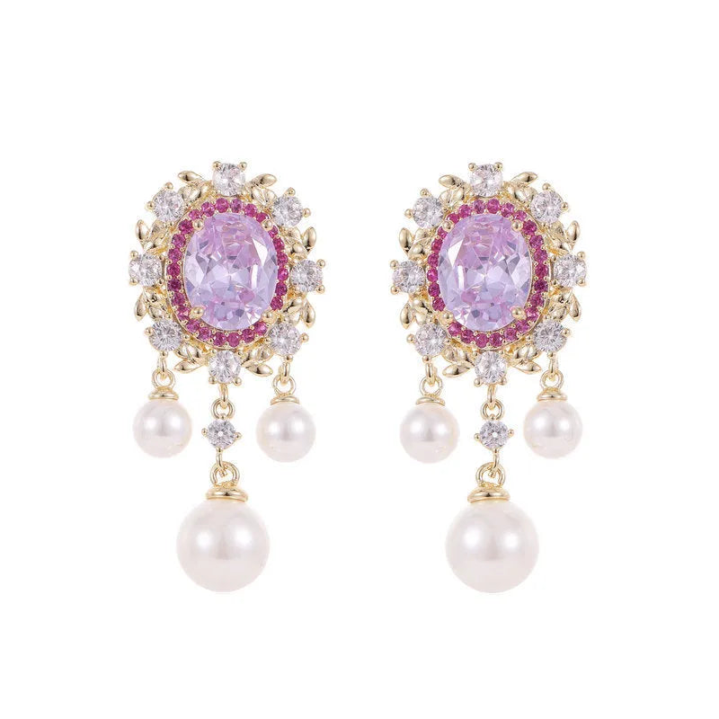 Oval geometric copper earrings with inlaid zircon centre and white pearl tassel drop in light purple colour.
