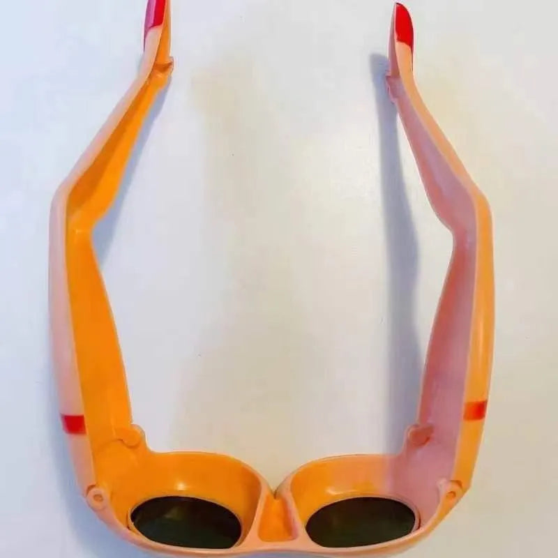 Orange novelty sunglasses with a leg and hip design theme and large rectangular lenses.