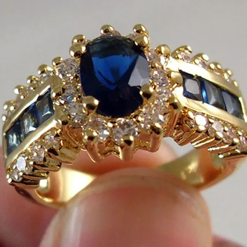 Personalised zinc alloy ring with blue diamond or coloured zircon designs in sizes 6 to 11.