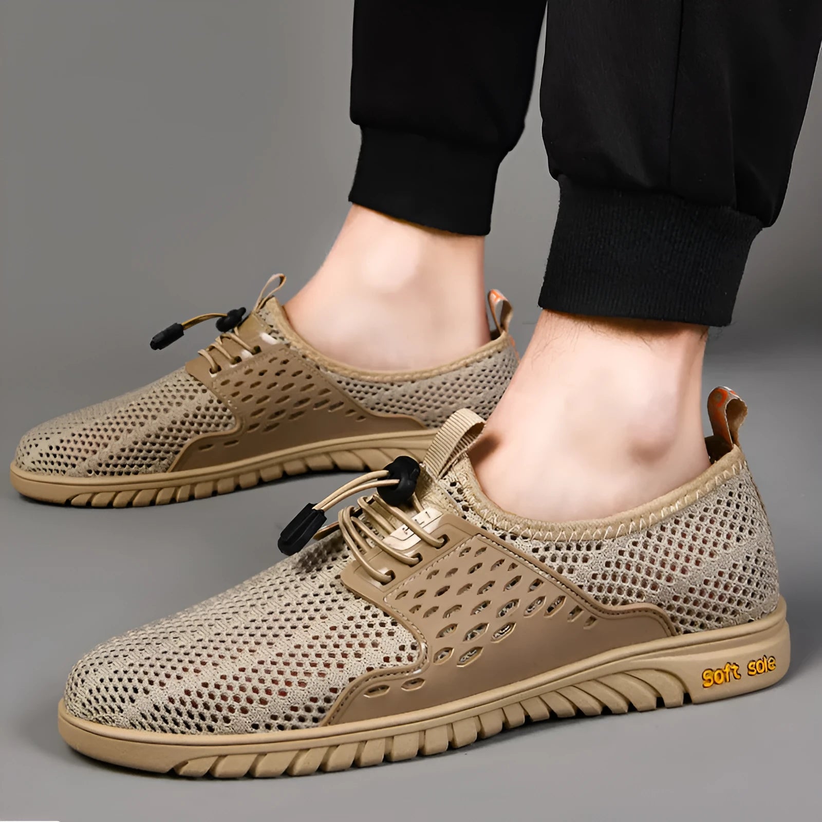 Men's breathable casual shoes in black, grey or sand with mesh upper and elastic band closure