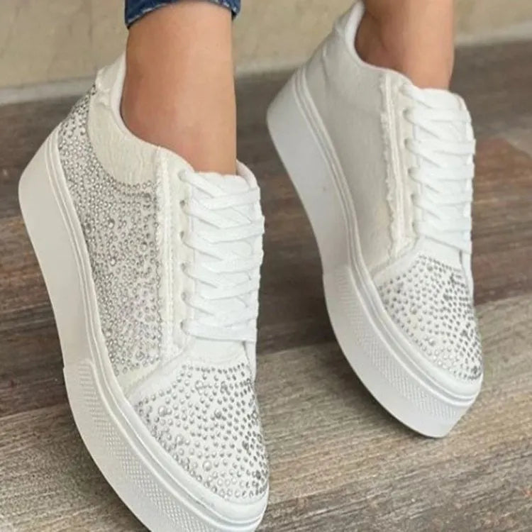 Women's black lace-up casual sports shoes with rhinestone detail on the side and a chunky rubber sole.