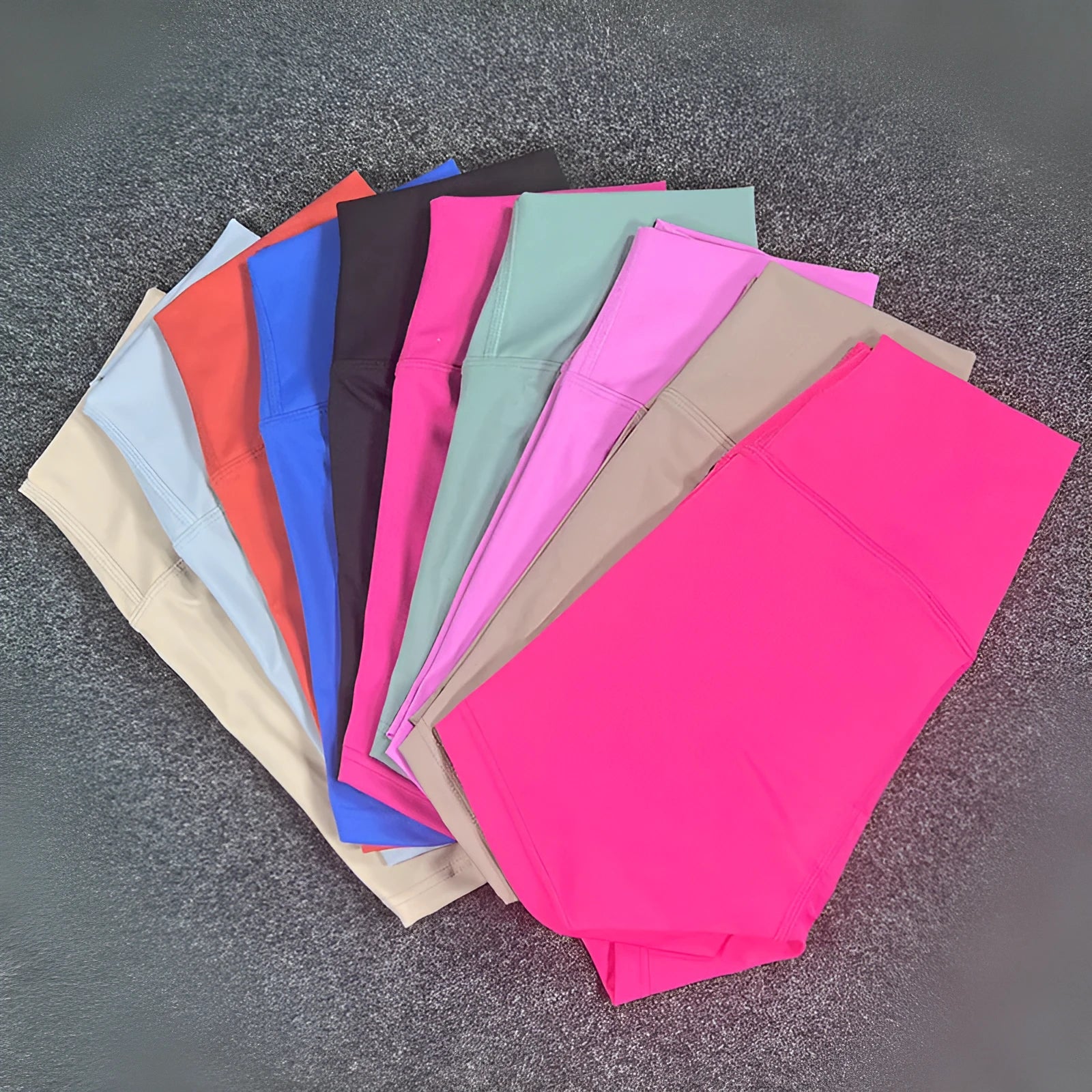 Women's high-waisted yoga shorts in nylon fabric, shown in multiple colours including black and pink litchi.