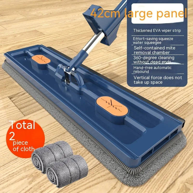 Large flat mop with long stainless steel handle and blue rotating mop head on a wooden floor.