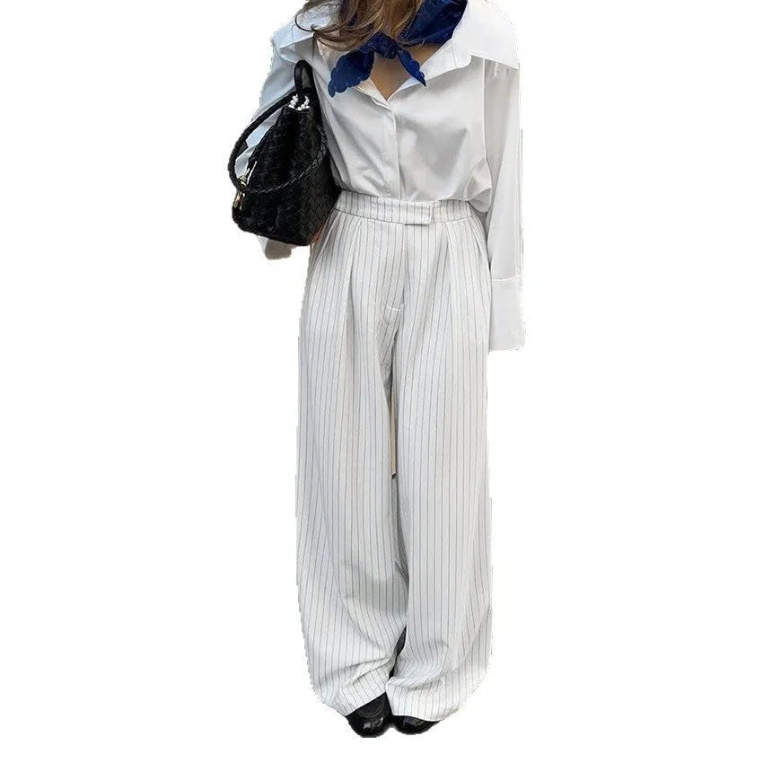 White striped wide-leg trousers with front zip fastening and loose casual cut for commuting