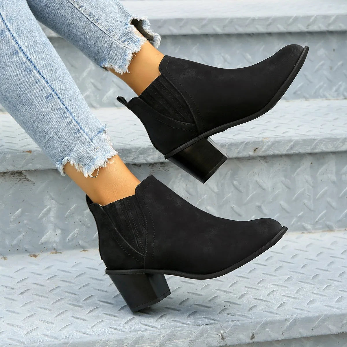 Women's black ankle boots with pointed toe, thick square heel and slip-on design