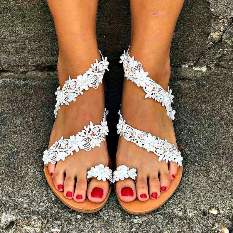 White plus size flat sandals with rhinestone flower patterns and slip-on sleeve design