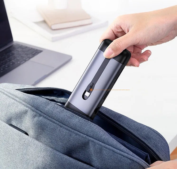 USB-C dock expansion adapter showing HDMI, USB 3.0, and charging ports with included connecting cables