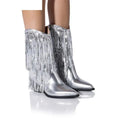 Women's black PU leather chunky heel boots with tassel decoration and a pointed toe on a stiletto heel.