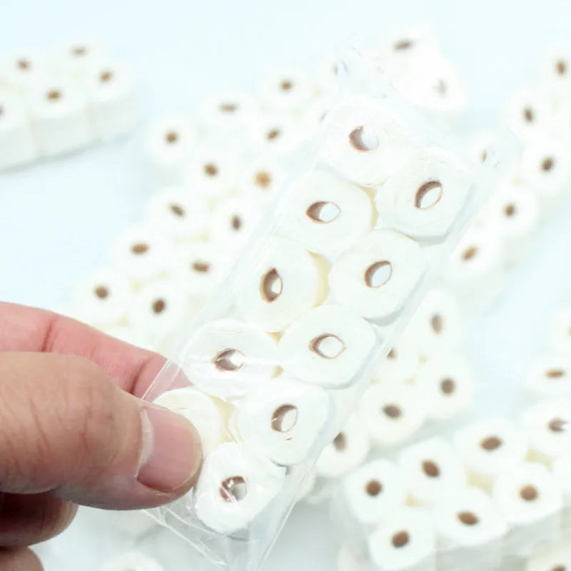Miniature simulated paper toilet paper roll model for childrens play, dimensions 30mm by 15mm by 80mm.
