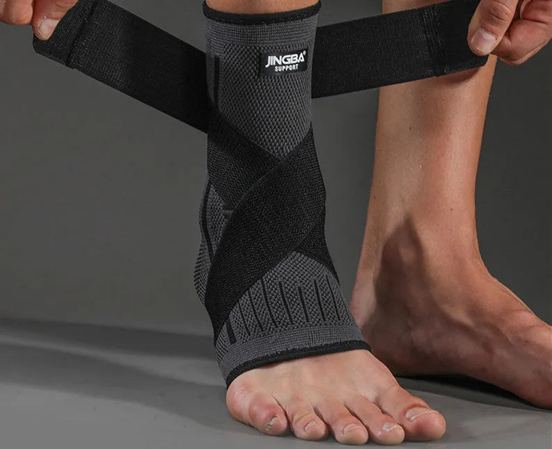 Sports ankle support in black, green or orange with adjustable compression strap