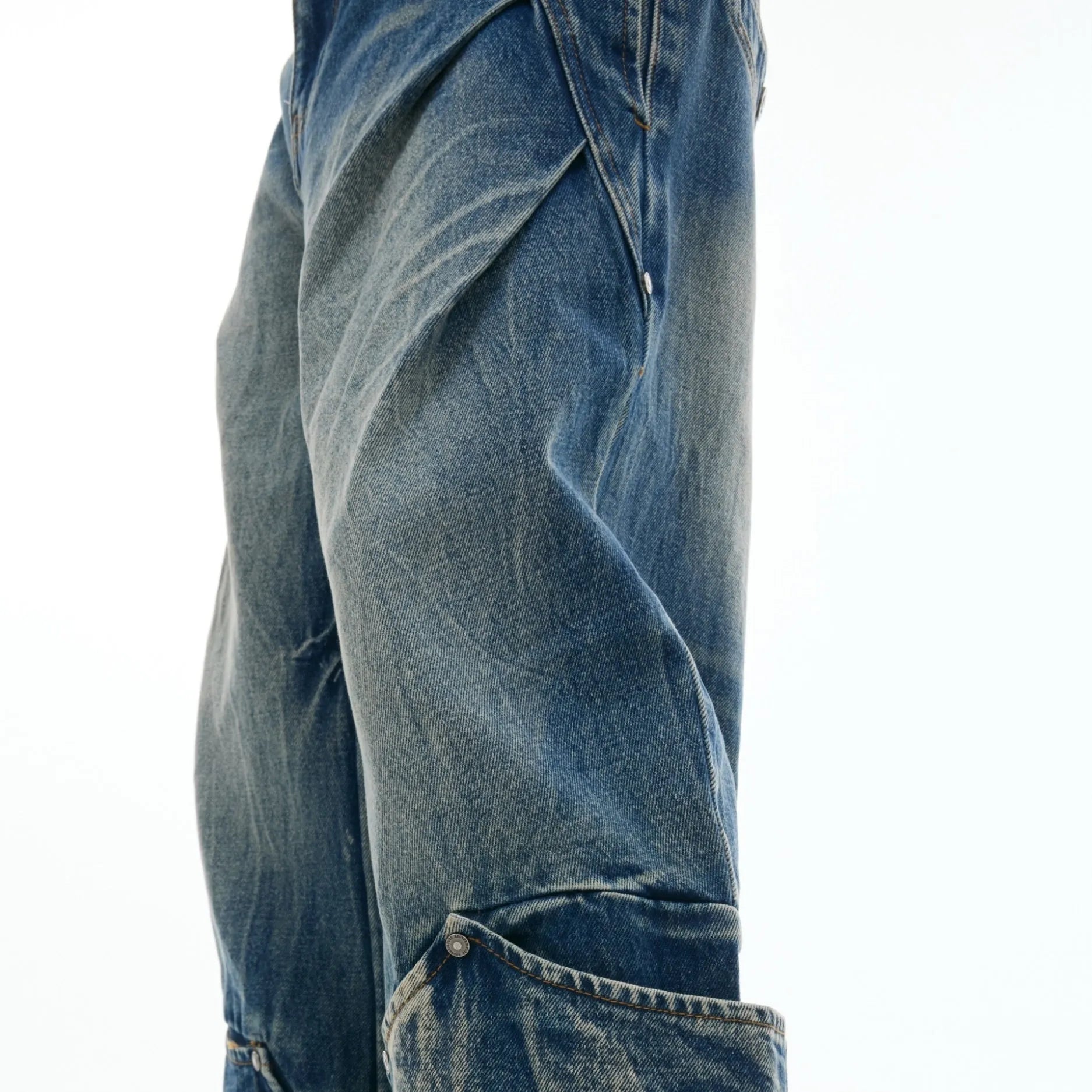 Men's retro washed burst pattern jeans in verdant blue with loose fit and curved knife style.