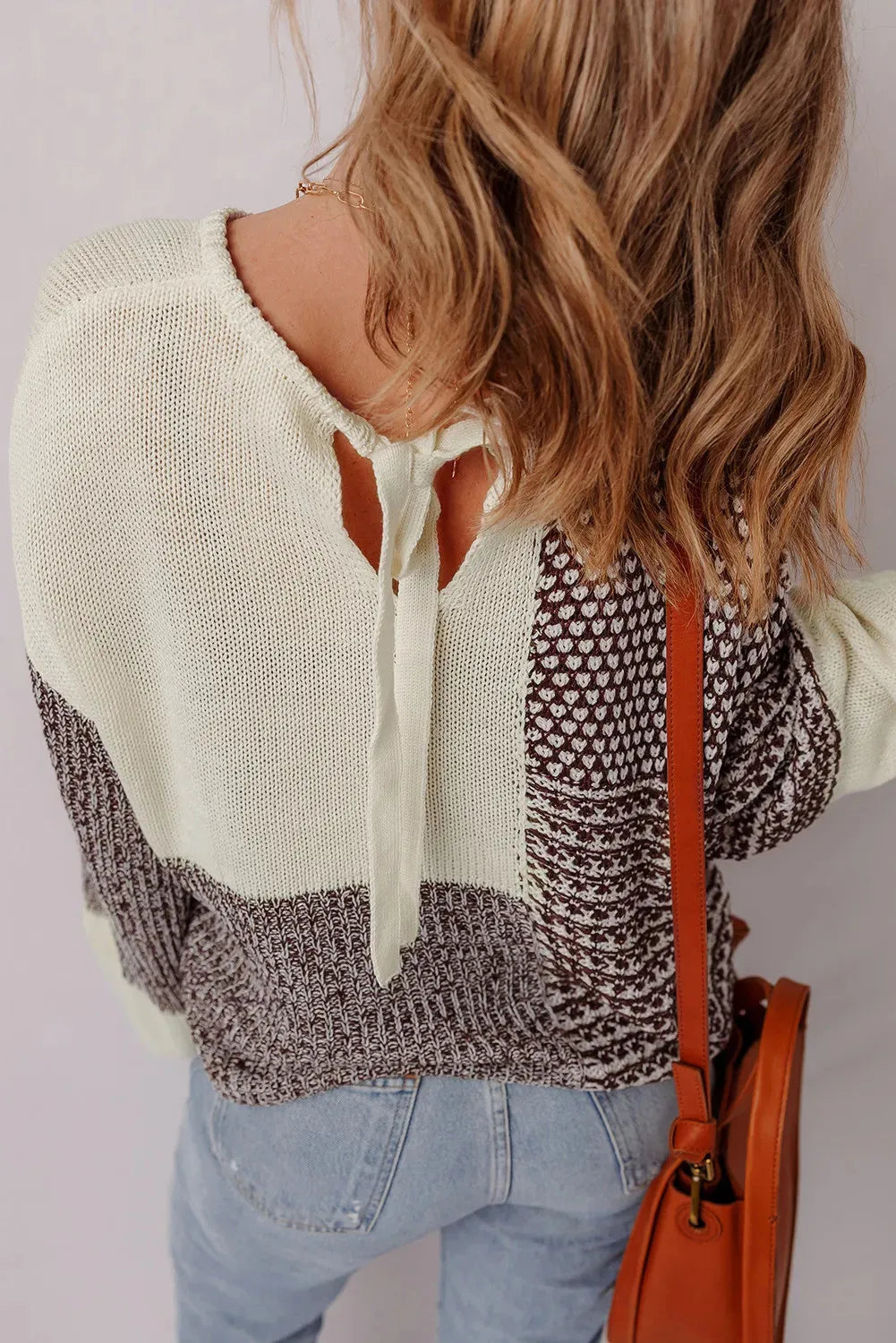 Dark khaki loose fit sweater with drop shoulders and a colour block back tie detail.