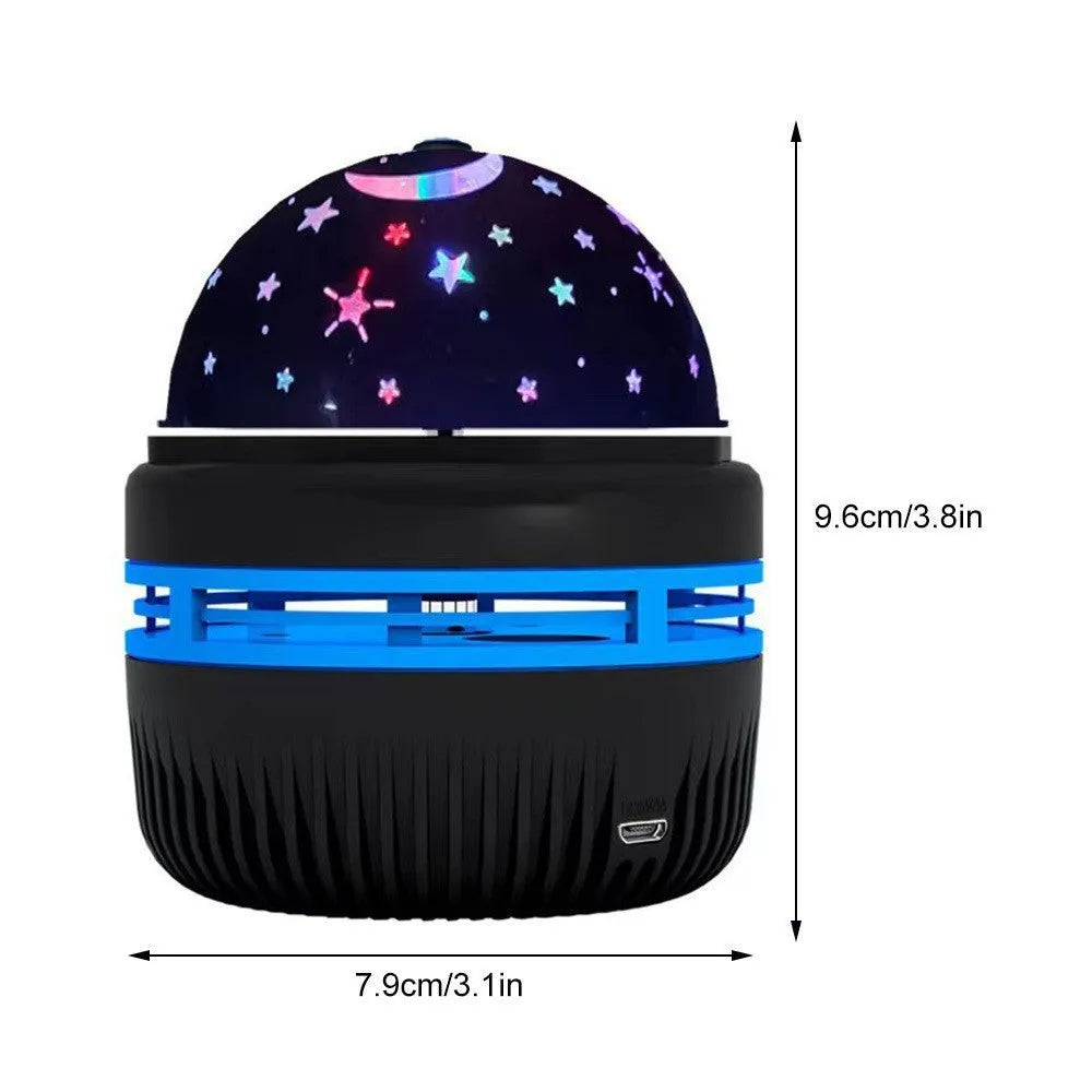 Compact LED galaxy projector night light with removable acrylic shade on a bedside table.