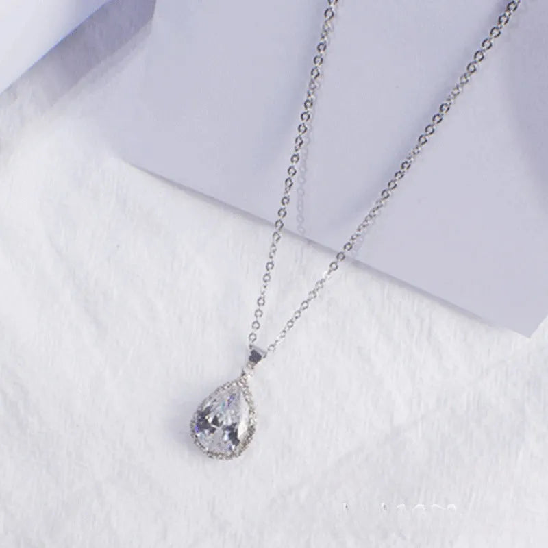 Women's drop shape necklace with rhinestone inlay and geometric design in pink colour option