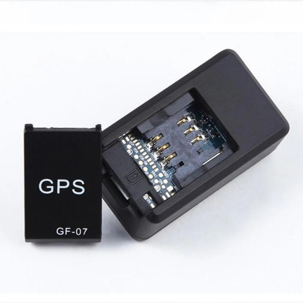 Small black magnetic GPS car tracker device for real-time vehicle and asset tracking.