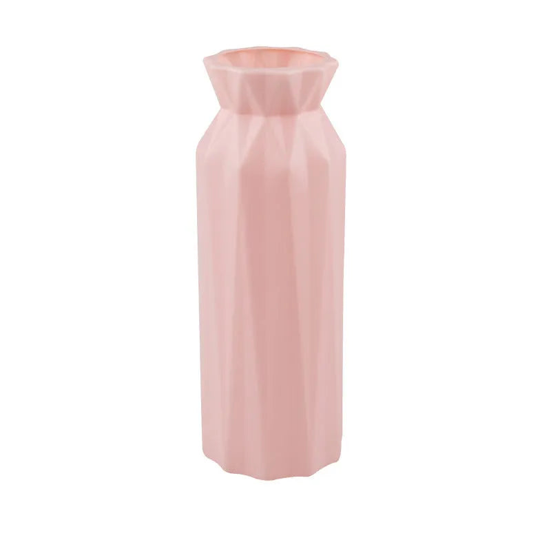 Grey melamine plastic vase with a wide 7.2cm base on a wooden table.
