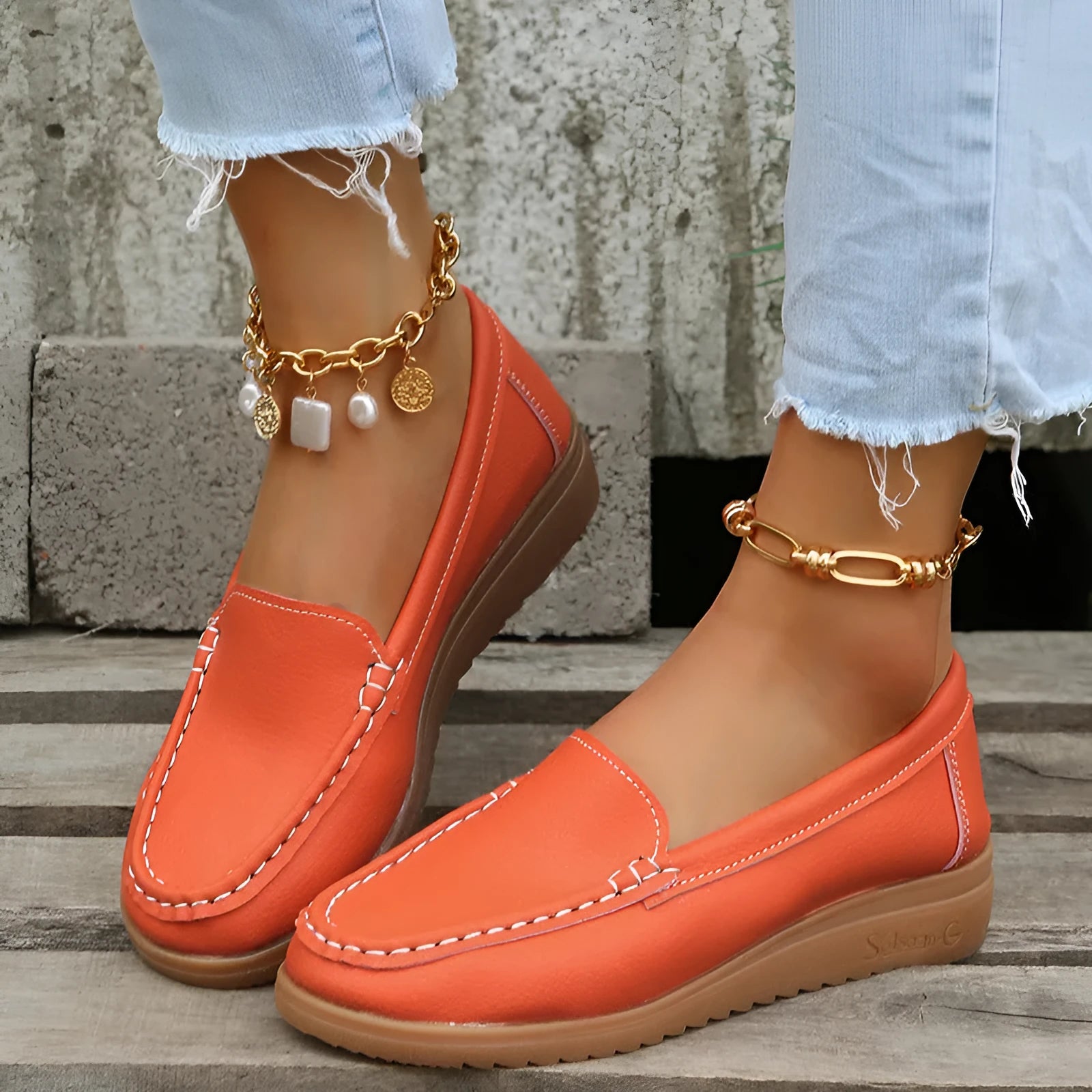 Women's flat laofer shoes in PU leather with car suture detail and a round toe, shown in multiple colours.