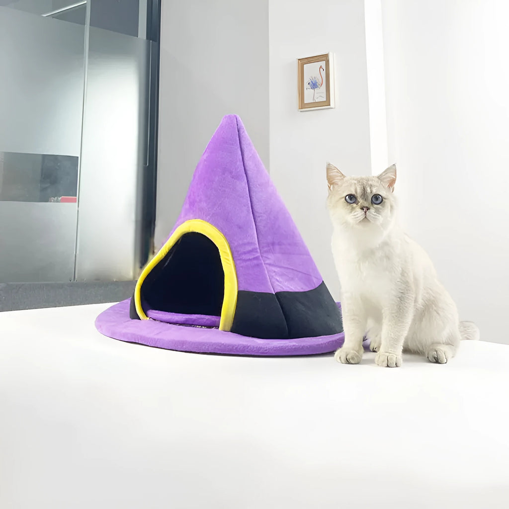Purple cloth witch hat shaped cat bed for small cats, dimensions 60cm by 45cm.