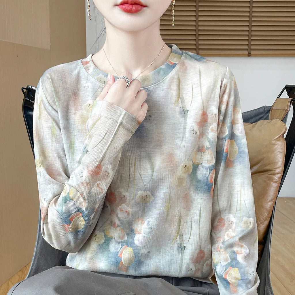 Women's round neck Tencel cotton pullover shirt in a floral print, showing front view.