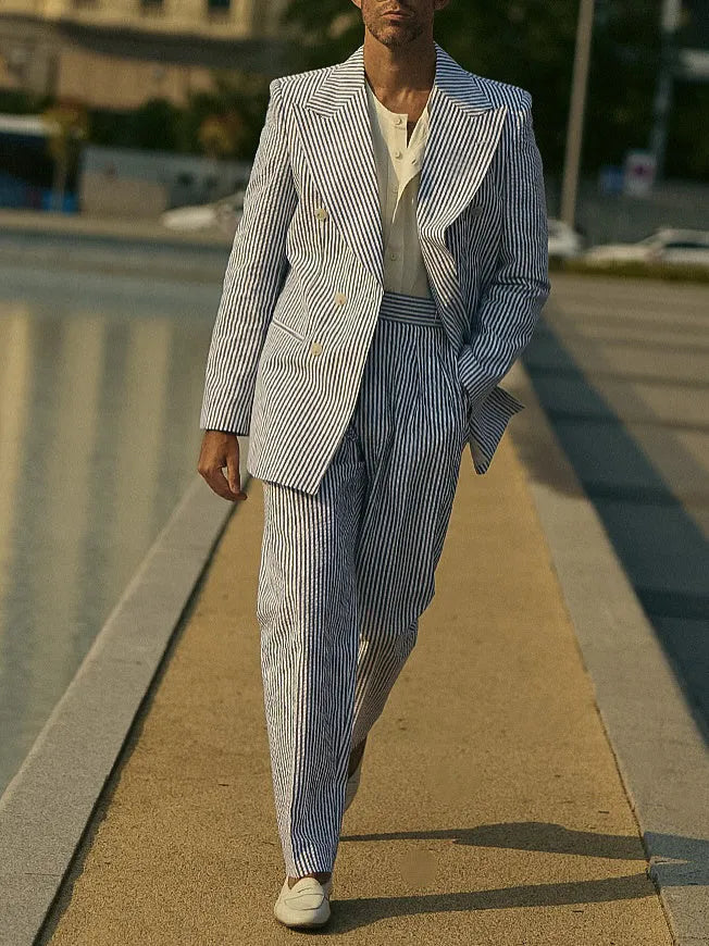 Women's blue and white striped polyester suit set with long-line blazer and matching trousers