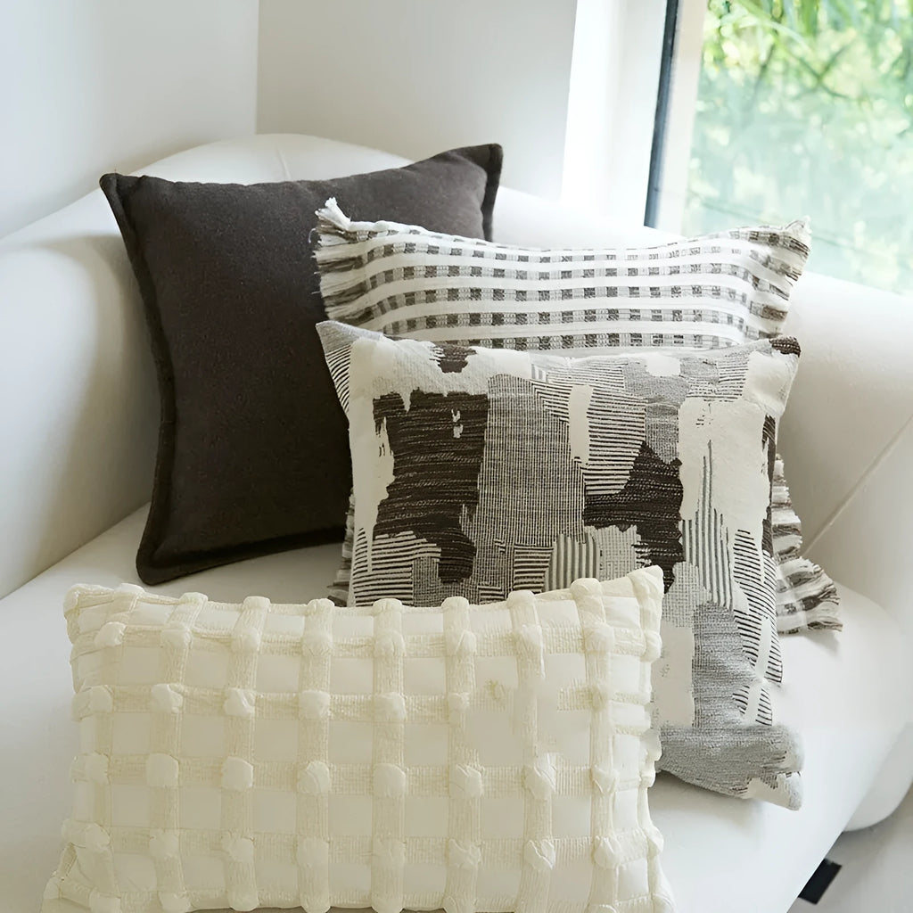 Coffee brown striped decorative cushion on a sofa in Chinese classical mid-century modern style.