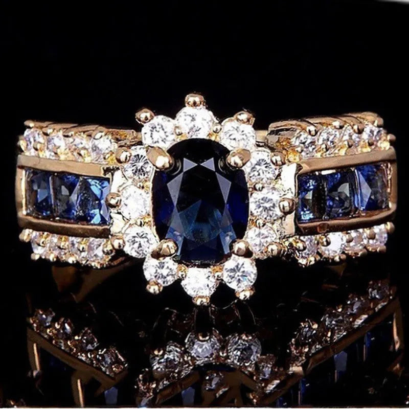 Personalised zinc alloy ring with blue diamond or coloured zircon designs in sizes 6 to 11.