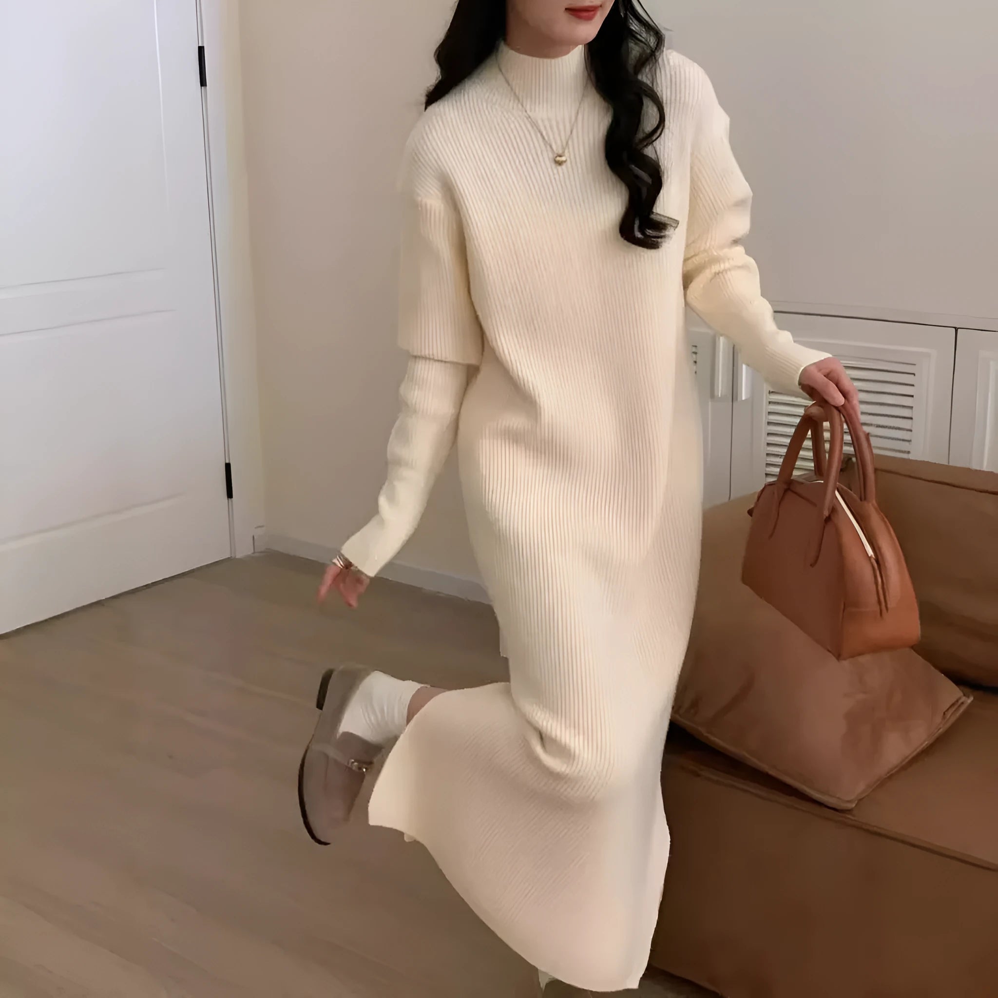 Women's beige half-turtleneck knitted midi dress with long sleeves on a hanger.
