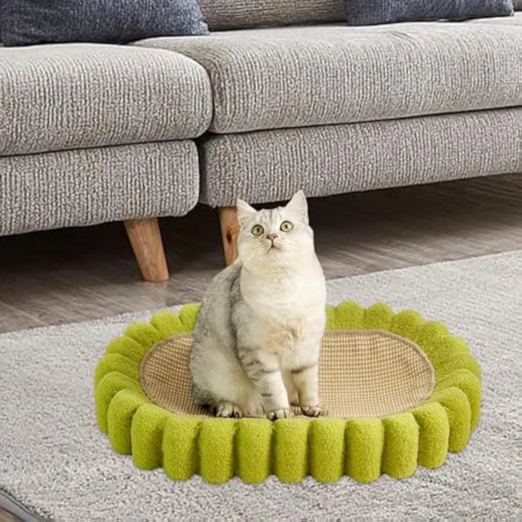 Green oval-shaped cat scratch pad and lounge bed made from textured sisal fabric.
