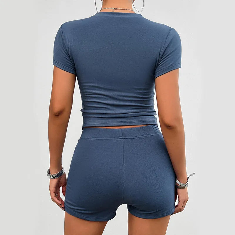Women's slim-fit viscose sports suit set with short-sleeved t-shirt and elastic shorts in grey blue.