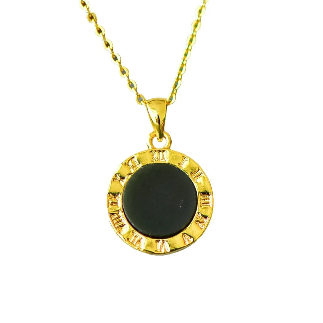 Flat Hetian gray jade pendant with copper inlay on a necklace chain.