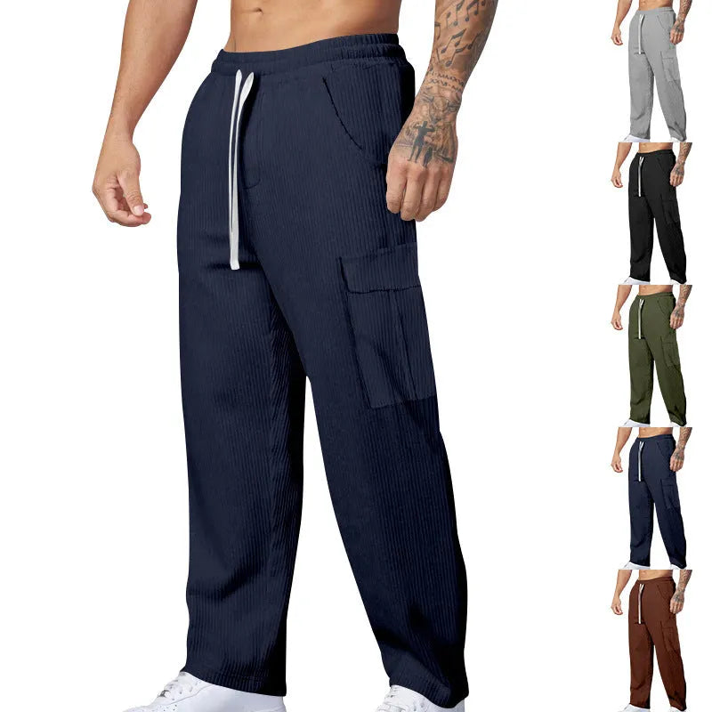 Men's straight leg corduroy cargo trousers in army green with a drawstring waist and loose wide-leg fit.