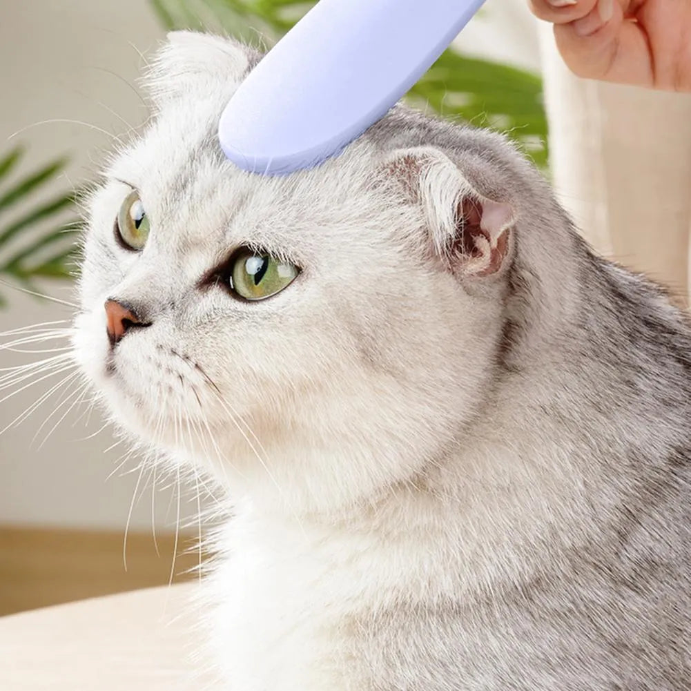 Gray and pink cat comb with tongue-massage design for pet hair removal