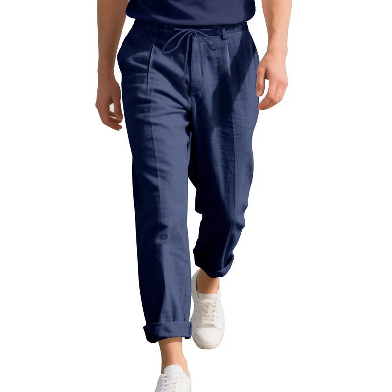 Men's linen casual trousers in light khaki colour with loose straight-leg fit and drawstring waist