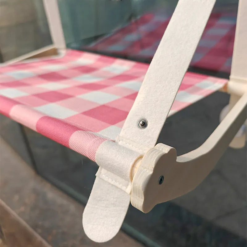 Cat window hammock with wooden frame and linen fabric, secured by four suction cups, in pink colour option