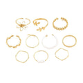 Women's gold alloy ring with openwork flower design and glossy electroplated finish