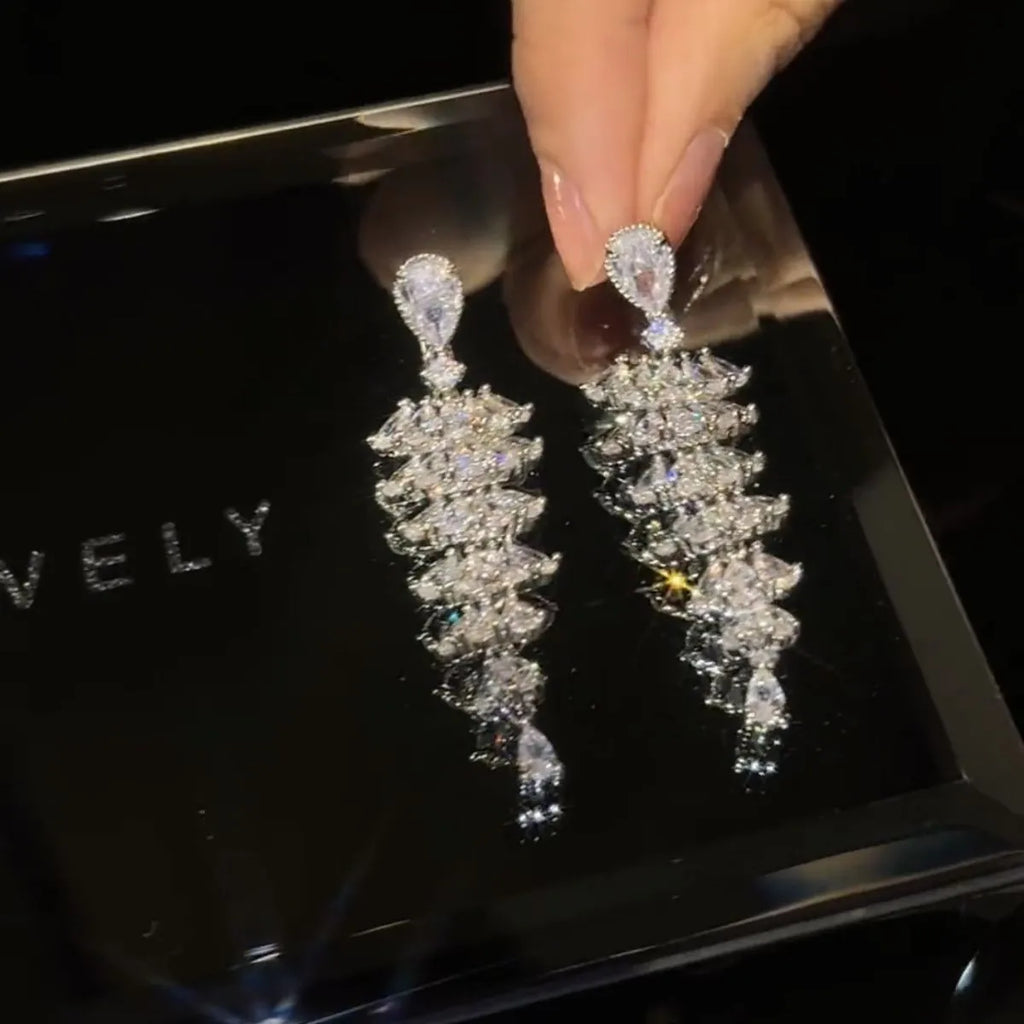 Silver pagoda-shaped Christmas tree drop earrings with sparkling zircon stones