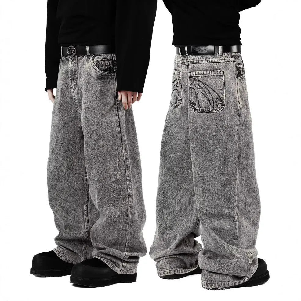 Grey loose fit straight-leg denim trousers for men and women on a neutral background