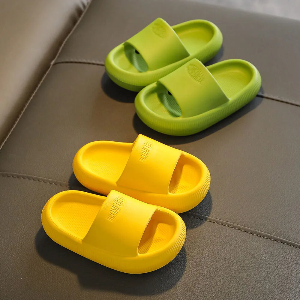 Children's bright coloured EVA slippers with textured non-slip soles on a white background.