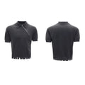 Man modelling a slim-fit black knitted polo shirt with an oblique diagonal zip closure and short sleeves.